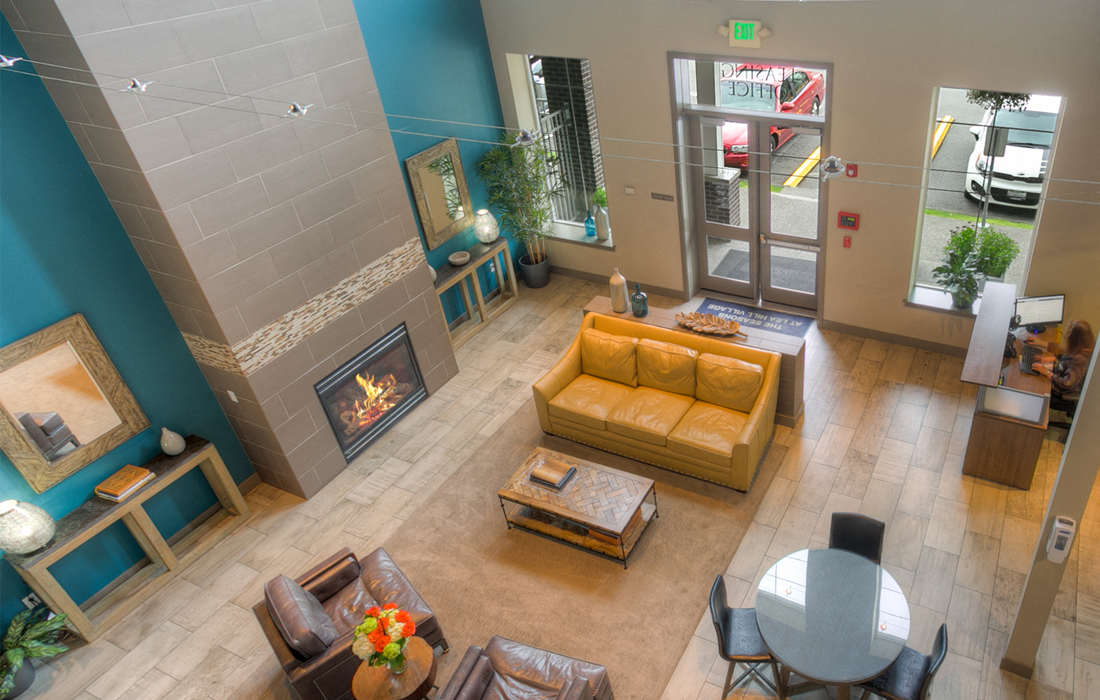 an overhead view of a living room with a fireplace and a table