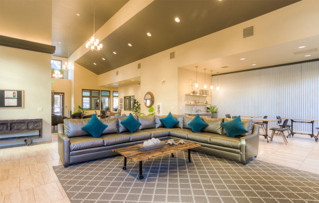 a living room with couches and a coffee table