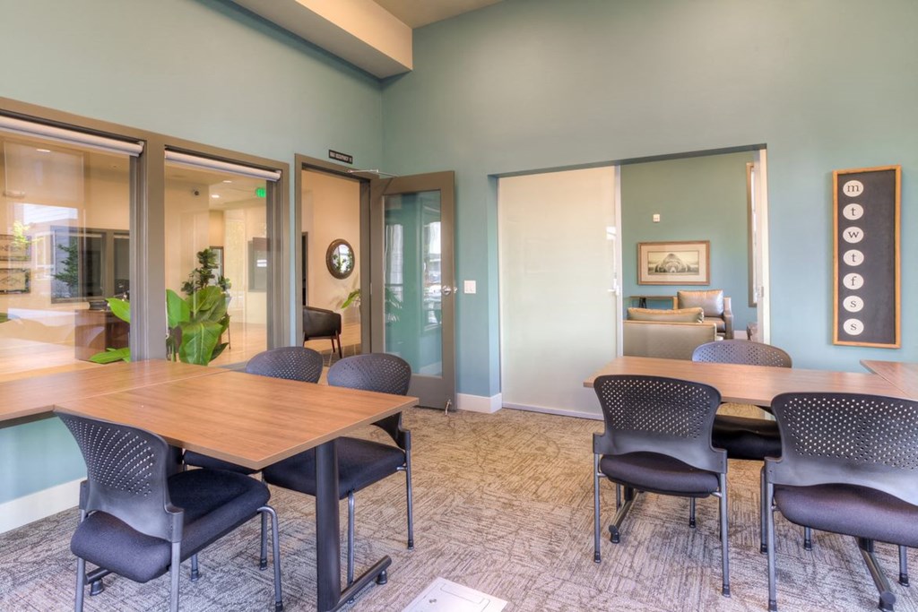 a conference room with a table and chairs
