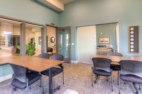 a conference room with a table and chairs