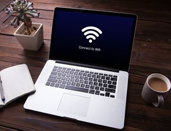 A laptop screen displays a "Connect to WiFi" message.