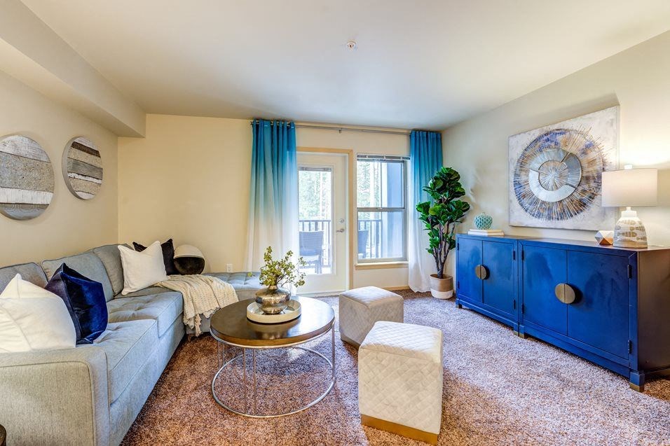 a living room with a blue cabinet and a couch