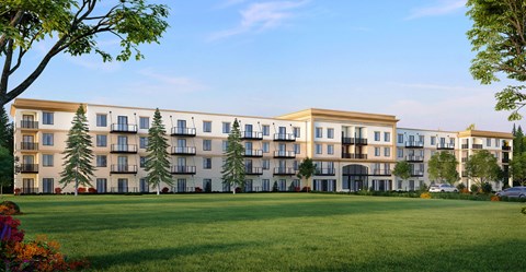 A large building with a lawn in front of it.