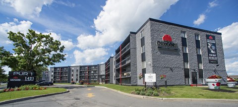 A large building with a red sign on it that says "Bayshore".
