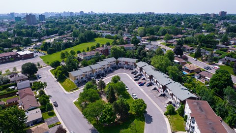 A bird's eye view of a residential area with houses and roads.