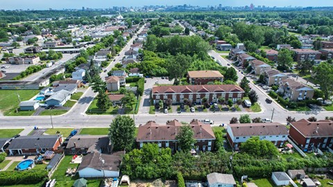 A suburban neighborhood with houses and greenery.