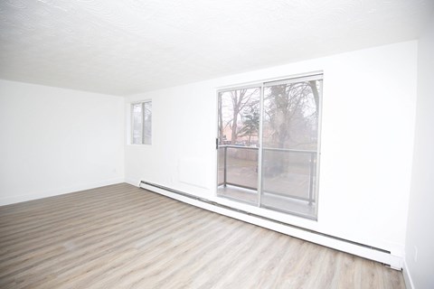 A room with a window and a door.