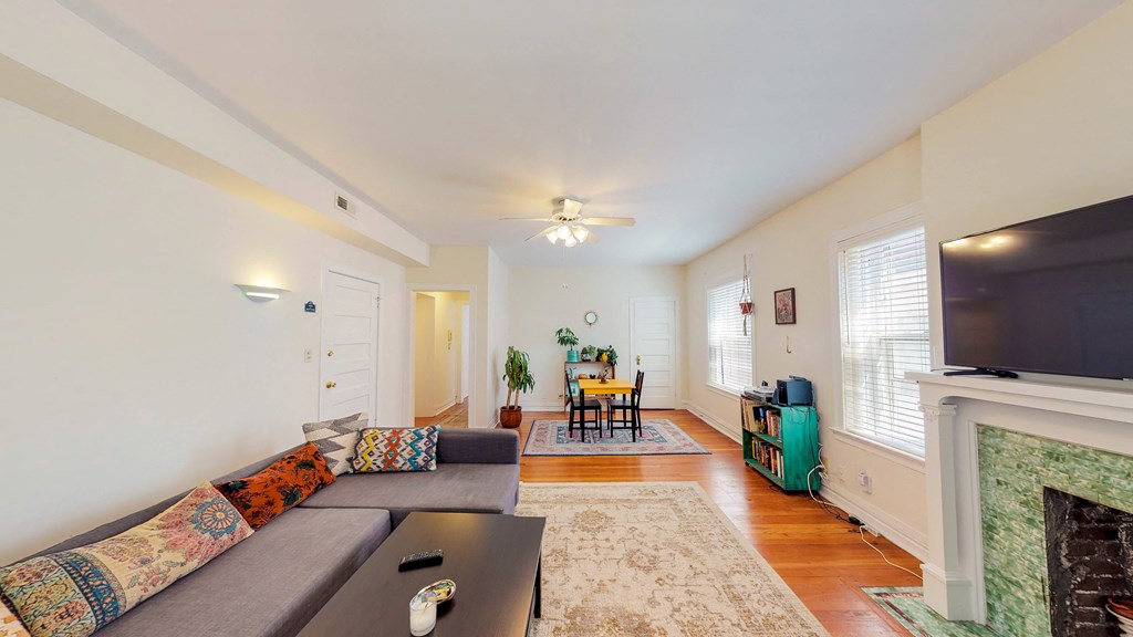 a living room with a couch and a tv