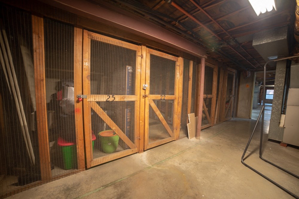 the inside of a garage with two large sliding doors