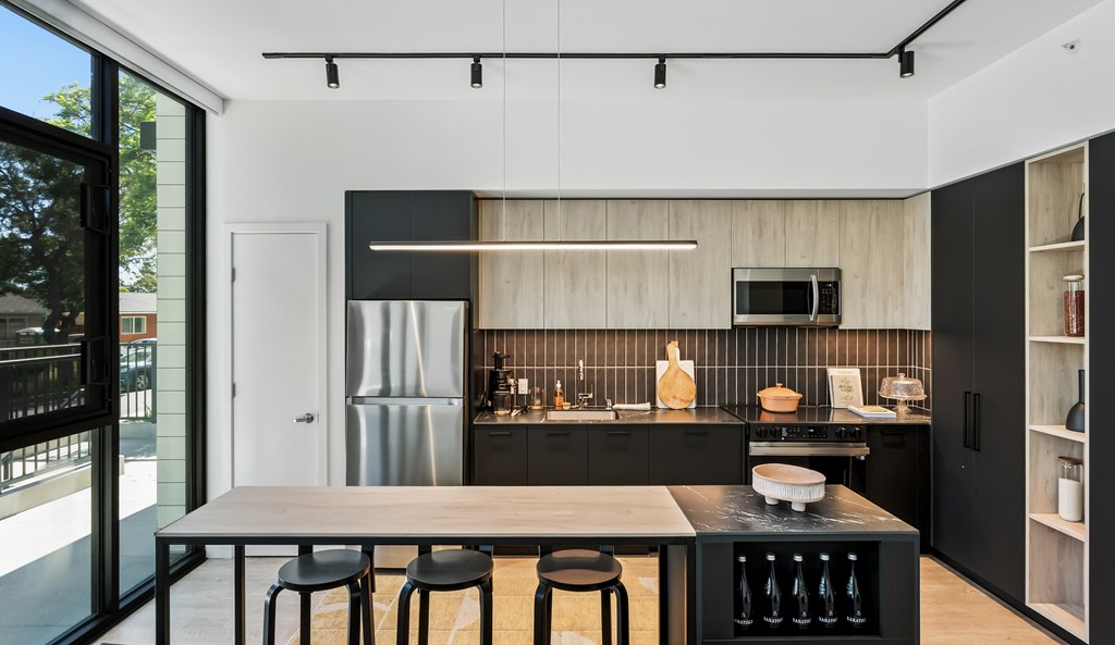 A modern kitchen with a black and white color scheme.
