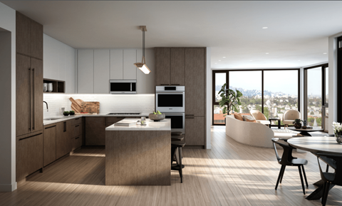 A modern kitchen with a dining table and chairs.