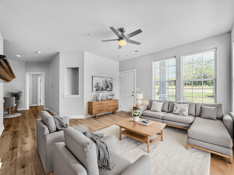a living room with couches and a coffee table