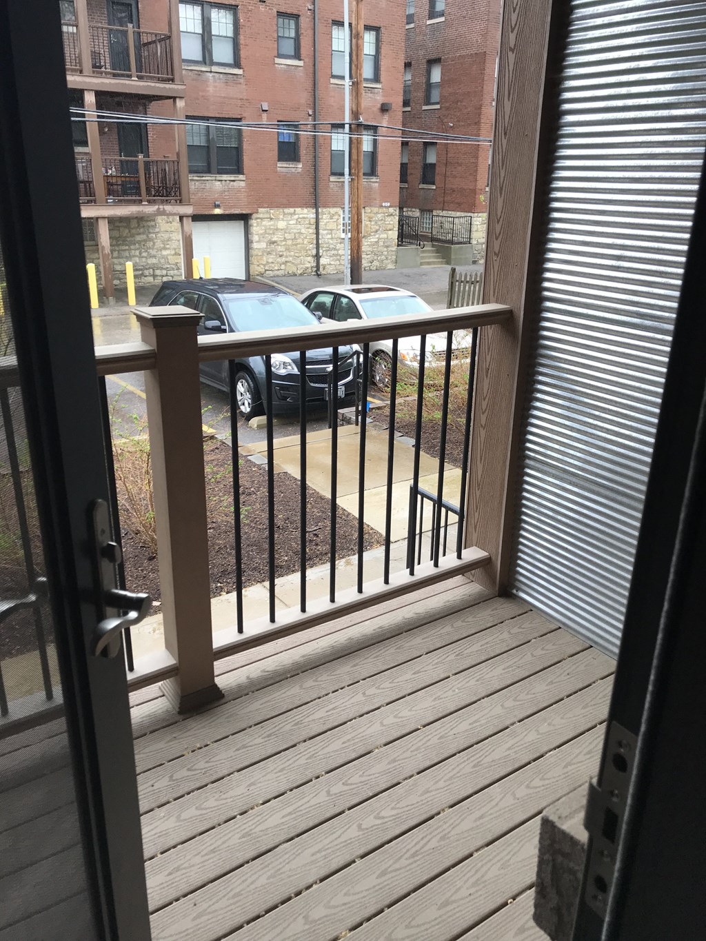 a balcony with a view of a parking lot