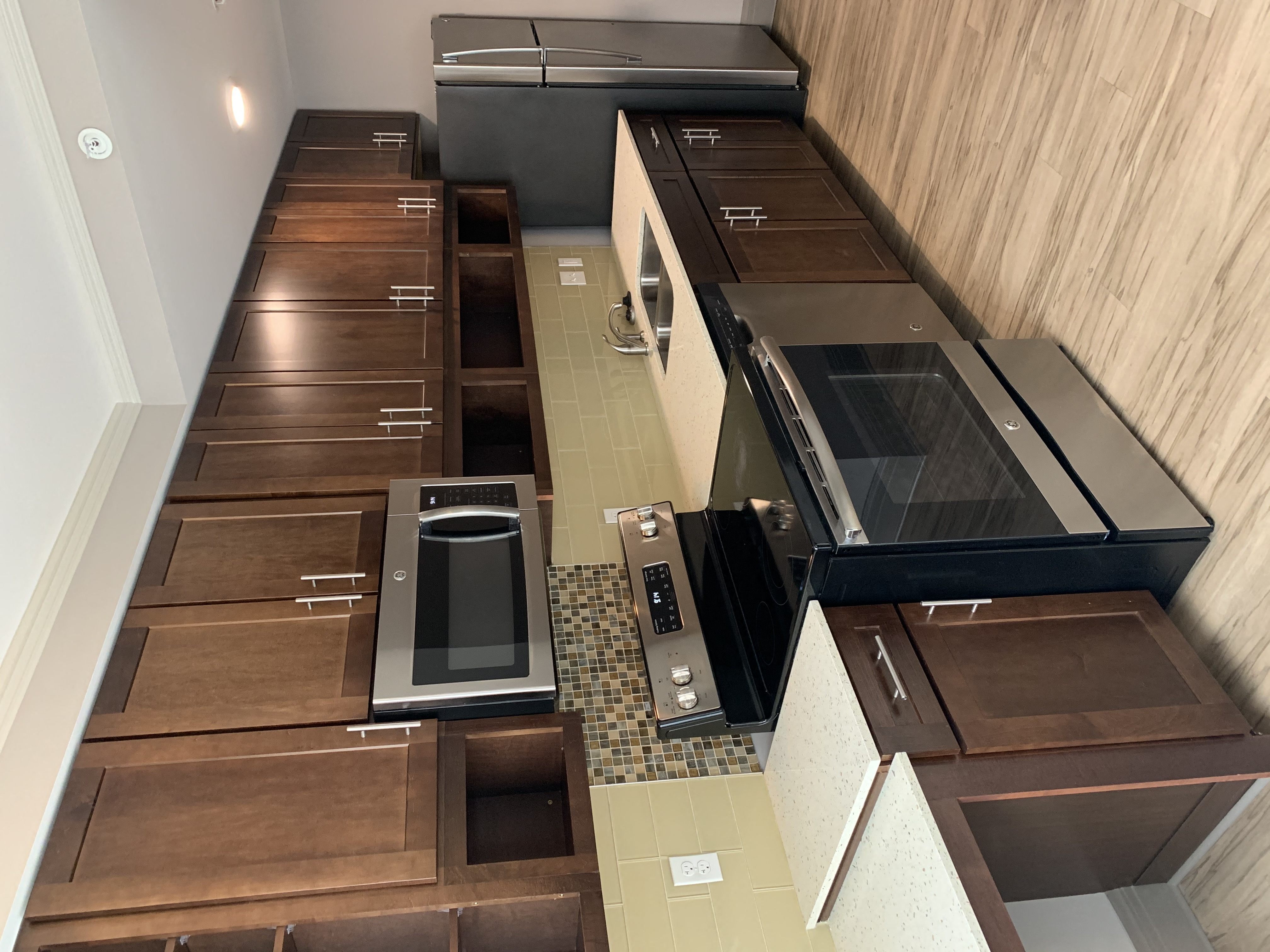 a view of a kitchen with counters and appliances