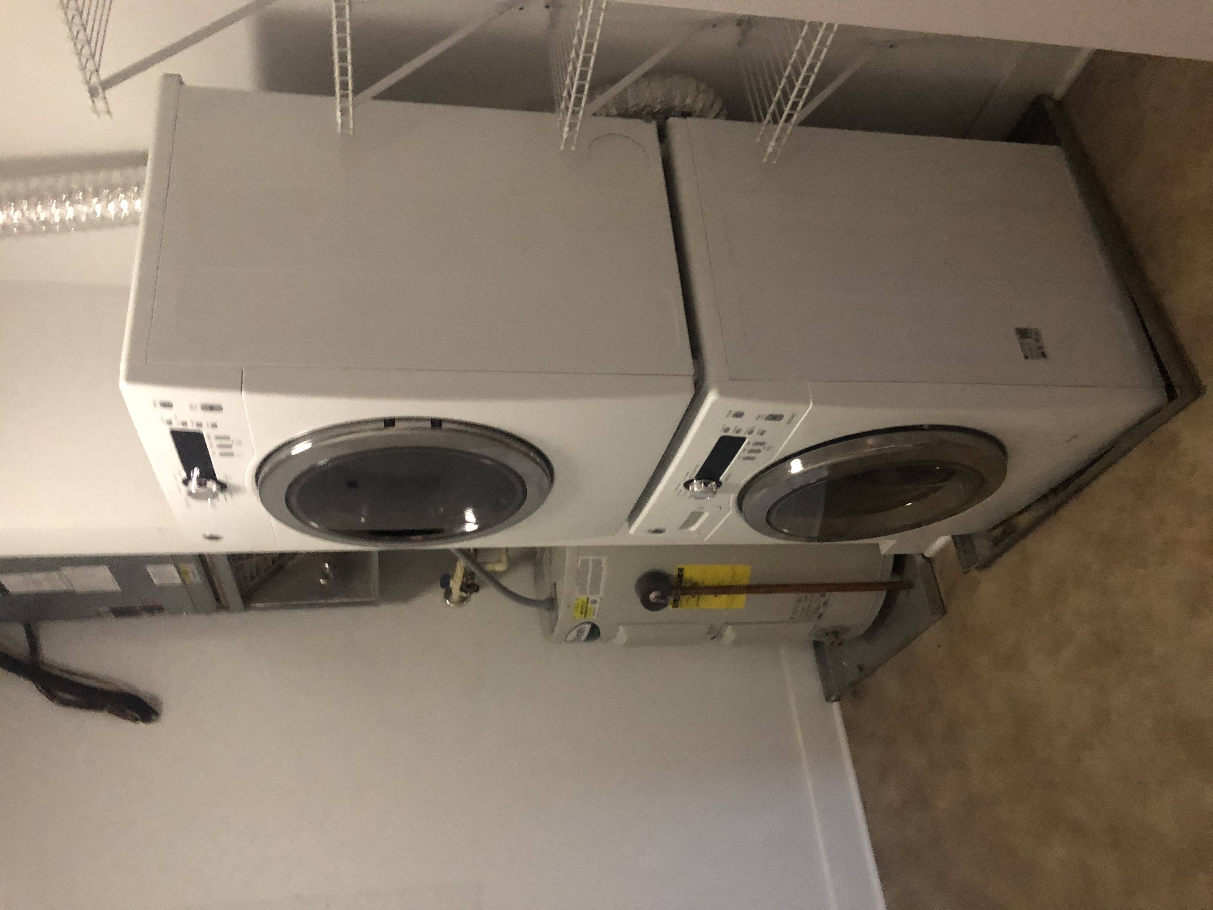 a washing machine and a dryer stacked on top of each other