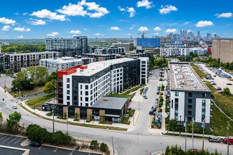 A cityscape with buildings and a clear sky.