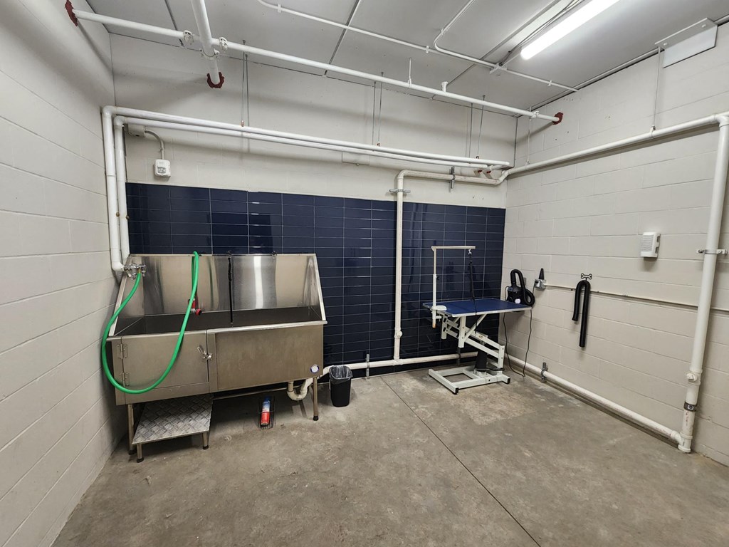 a room with a sink and a bath tub in it