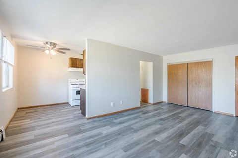 A spacious room with a washer and dryer in it.