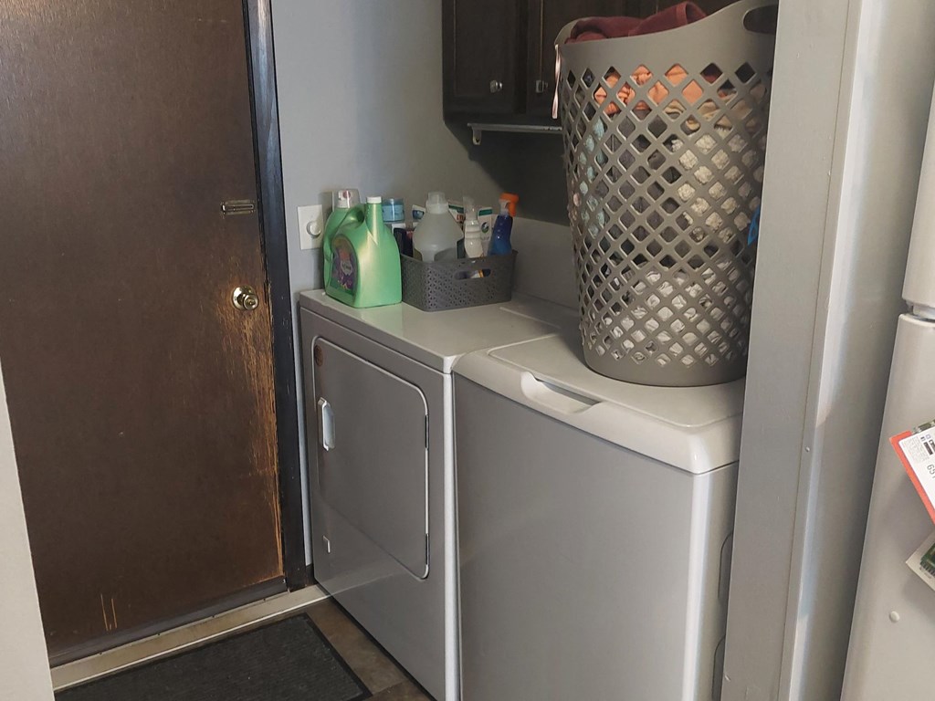 a laundry room with a washer and dryer