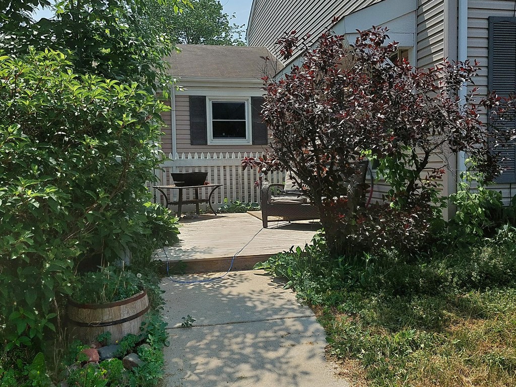 a backyard with a patio and a house