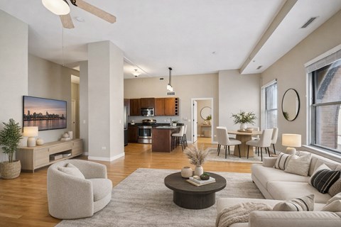 A modern living room with a large painting on the wall and a ceiling fan.