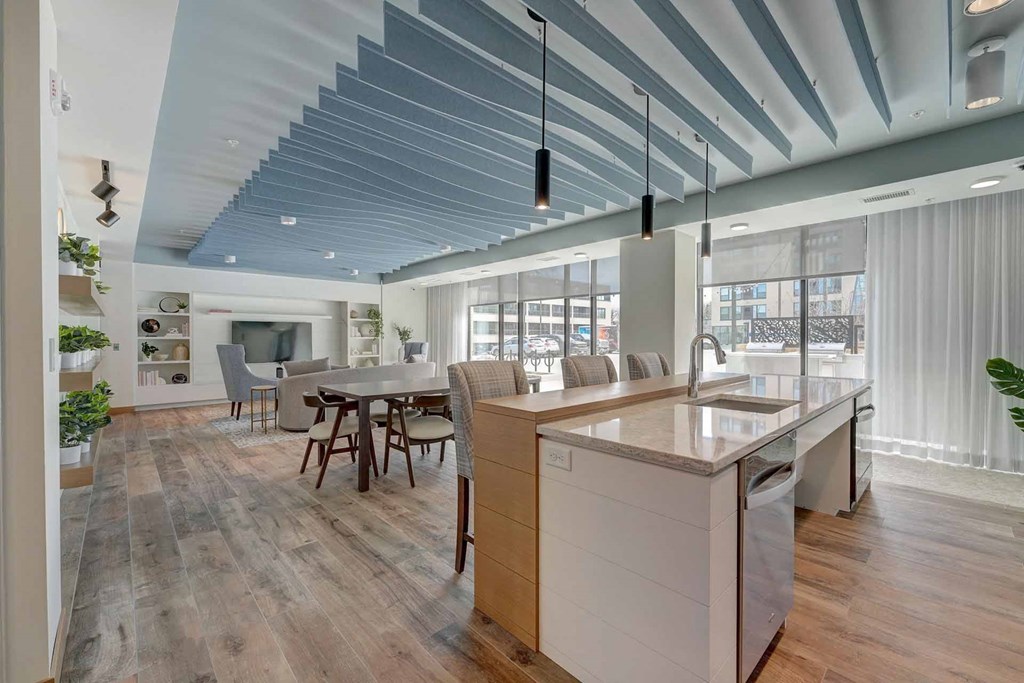 a kitchen with an island and a dining table