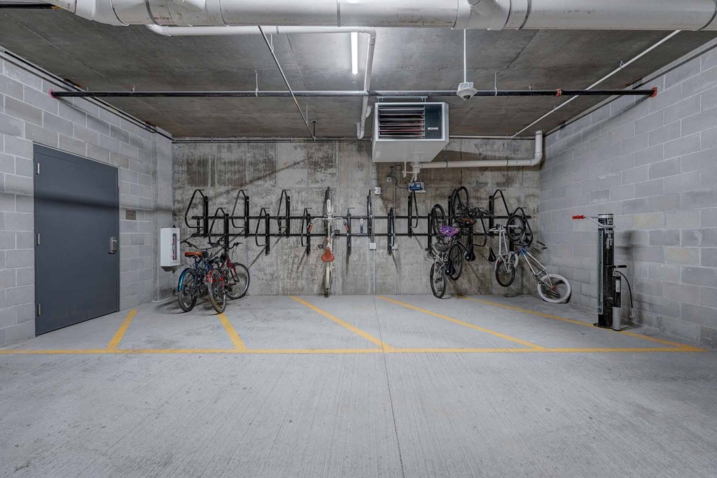 the bike rack in the garage of the building