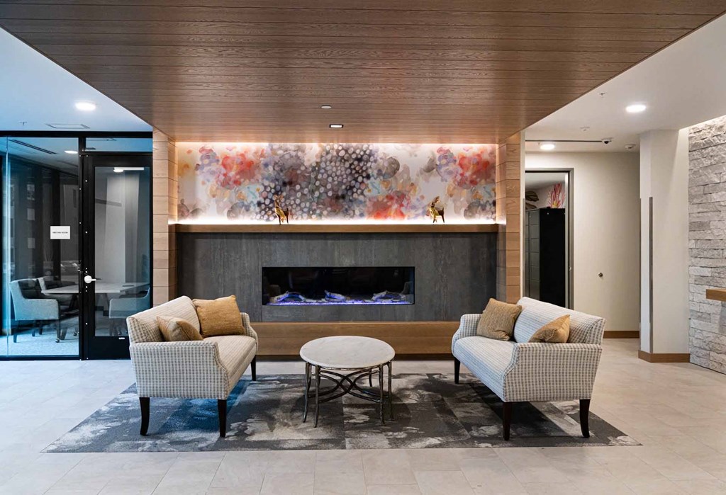 a living room with couches and a fireplace