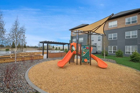 our apartments have a playground with swings and a gazebo