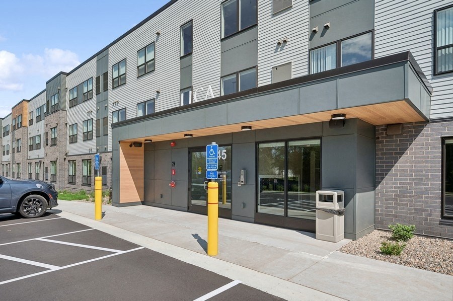 the residence on lamar apartment building entrance with parking lot and building facade