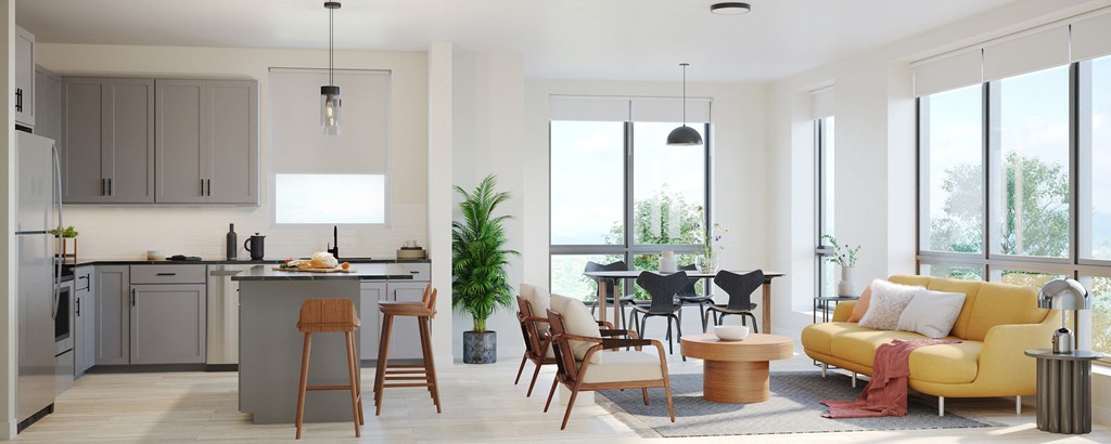 a living room with a couch and a kitchen with a table and chairs