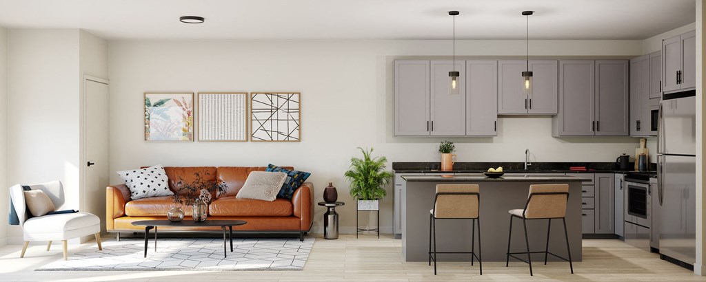 a living room with a couch and a kitchen