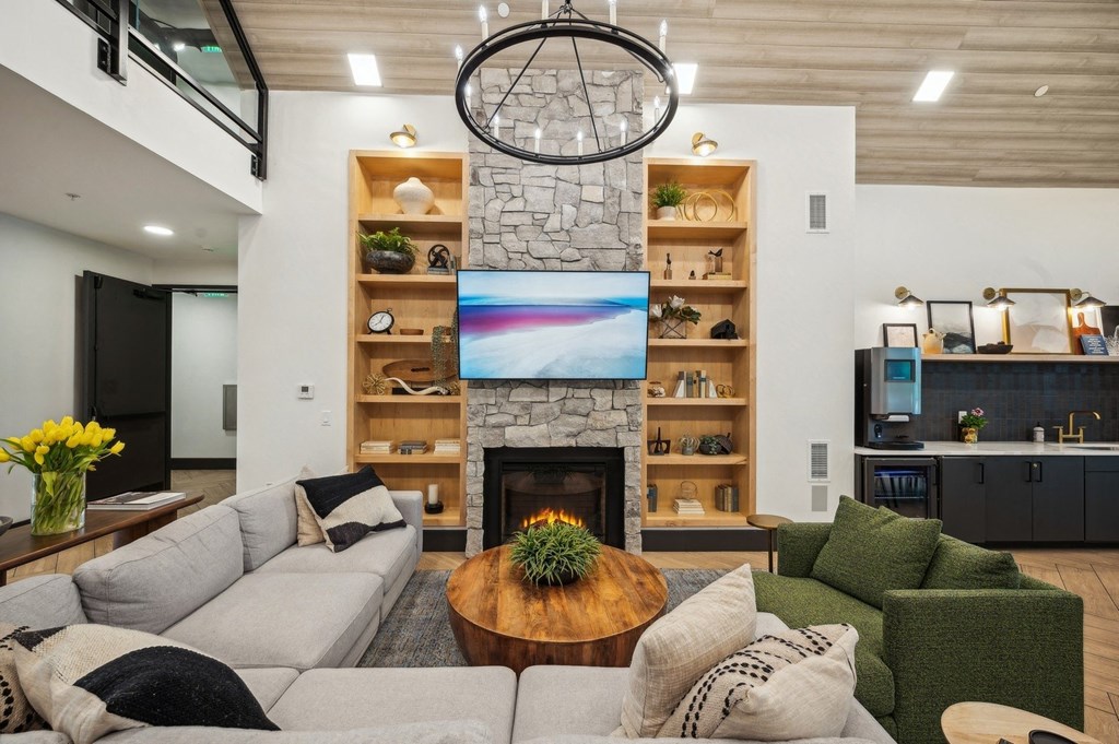 a living room with a couch and a fireplace