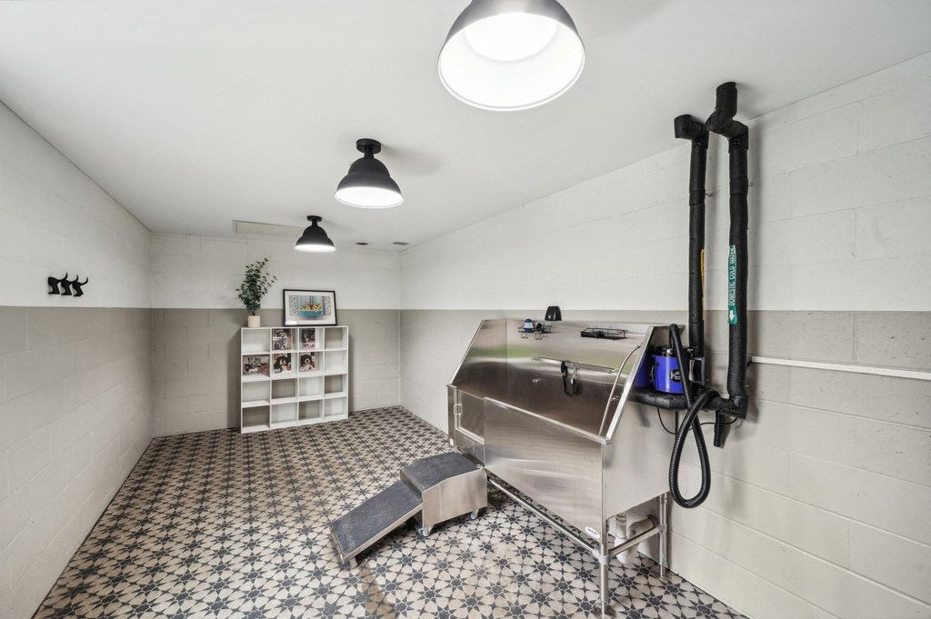 a kitchen with a stainless steel refrigerator and a stove