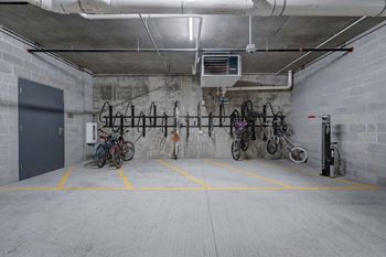 the bike rack in the garage of the building