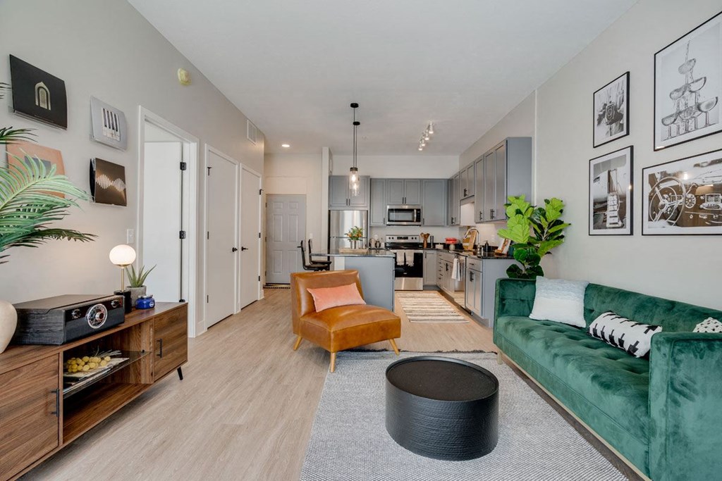 a living room filled with furniture and a large wall spelling out the