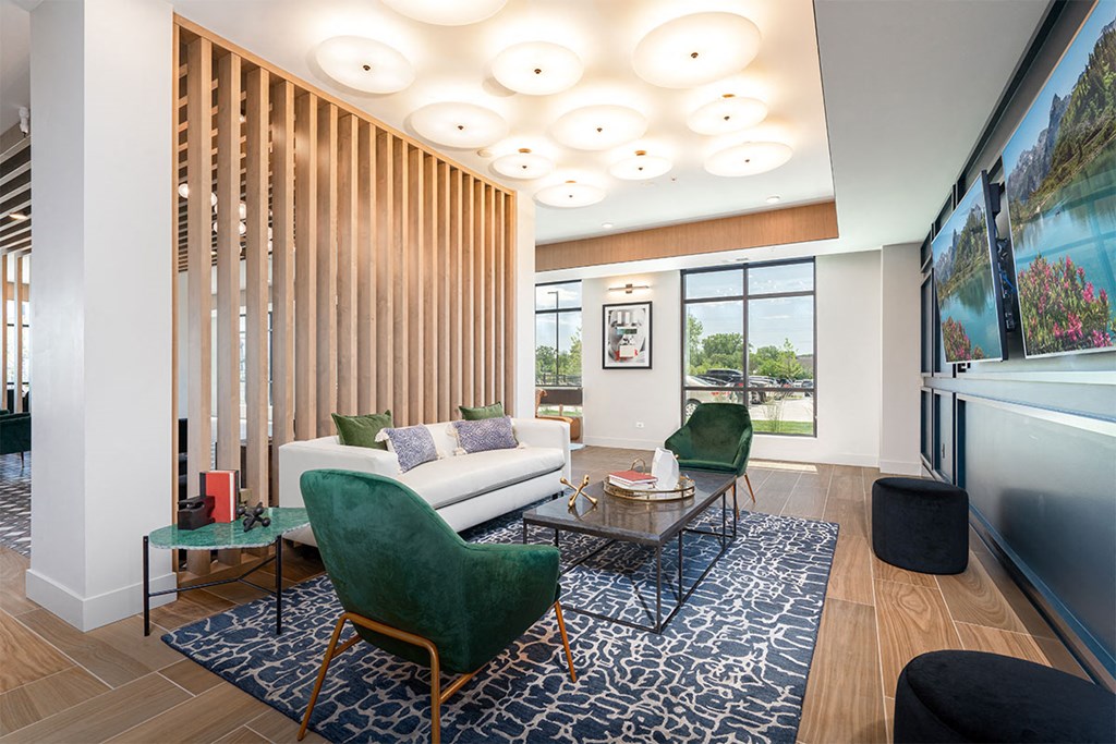 a living room with a couch and chairs and a table