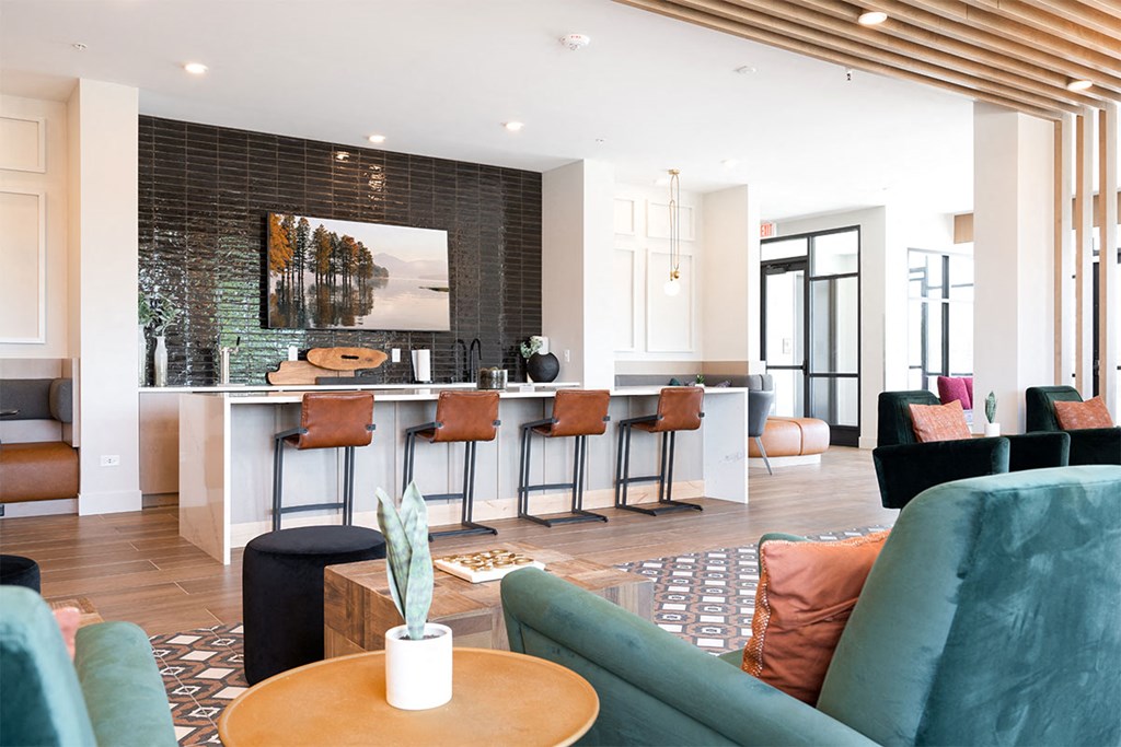 a living room with a bar and a dining room