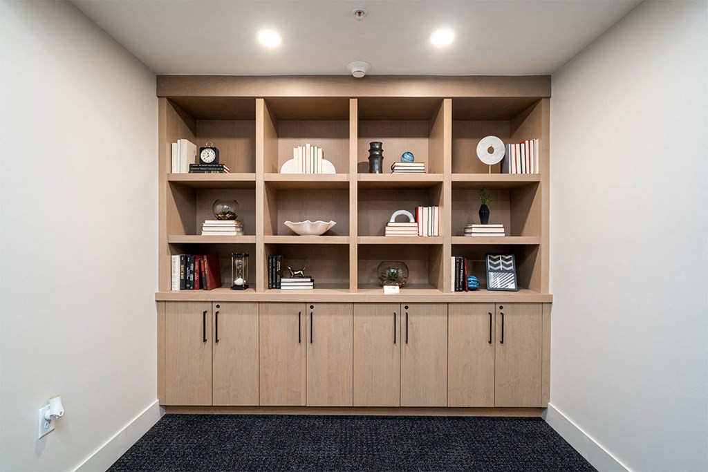 a bookshelf in a room with shelves