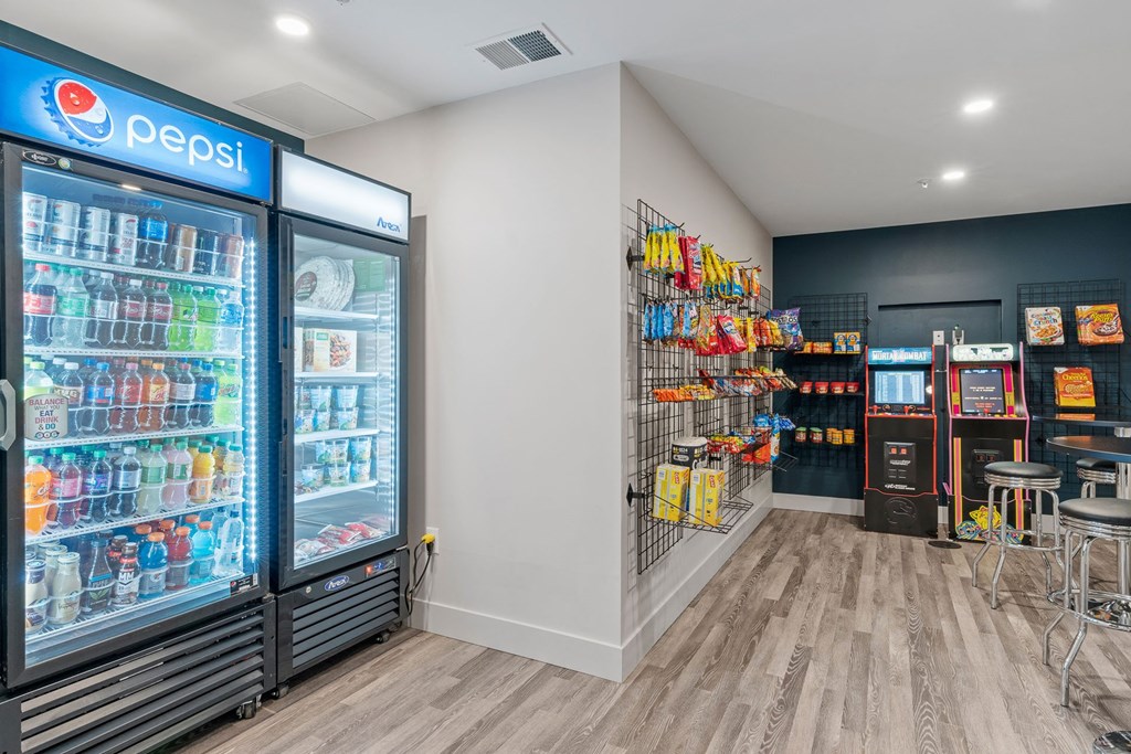 a convenience store with refrigerators and shelves of drinks