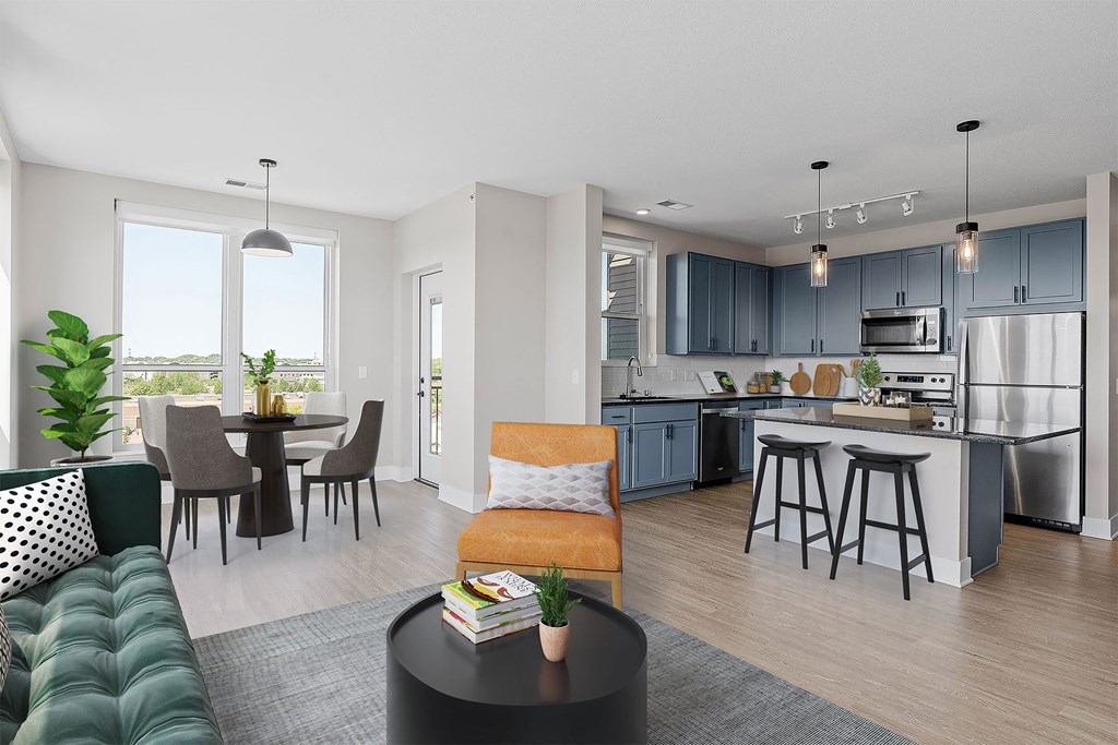 an open floor plan with a kitchen and living room