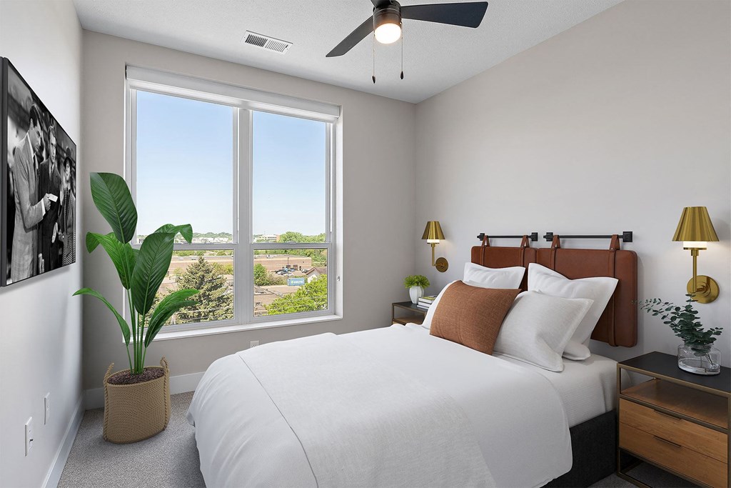 a bedroom with a large bed and a window