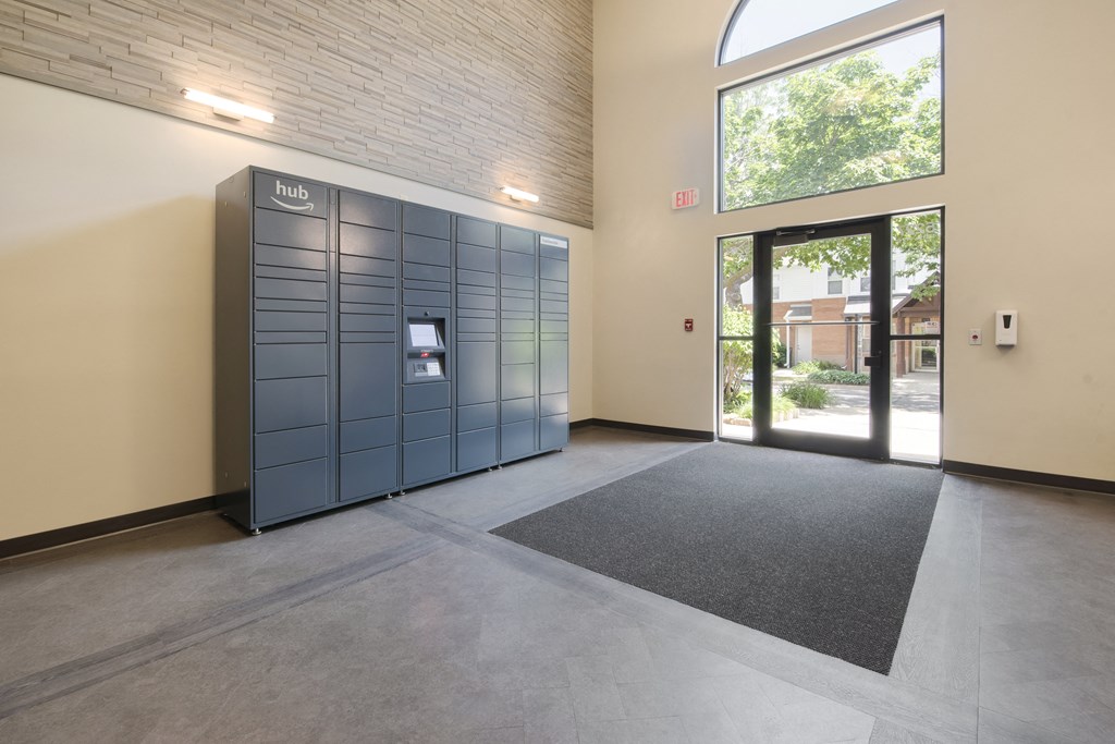 a blue locker in the center of a room with a glass door
