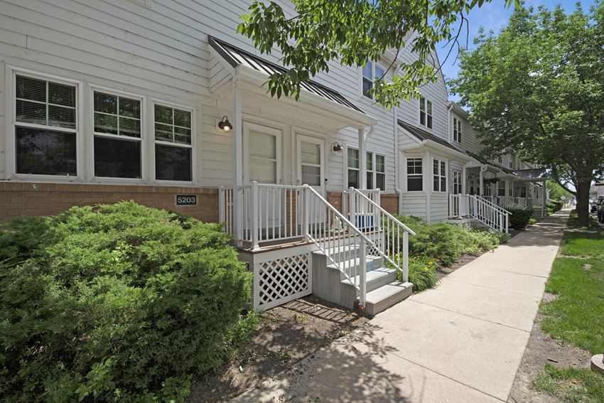 Townhomes a picture of a row of houses with a sidewalk in front of them