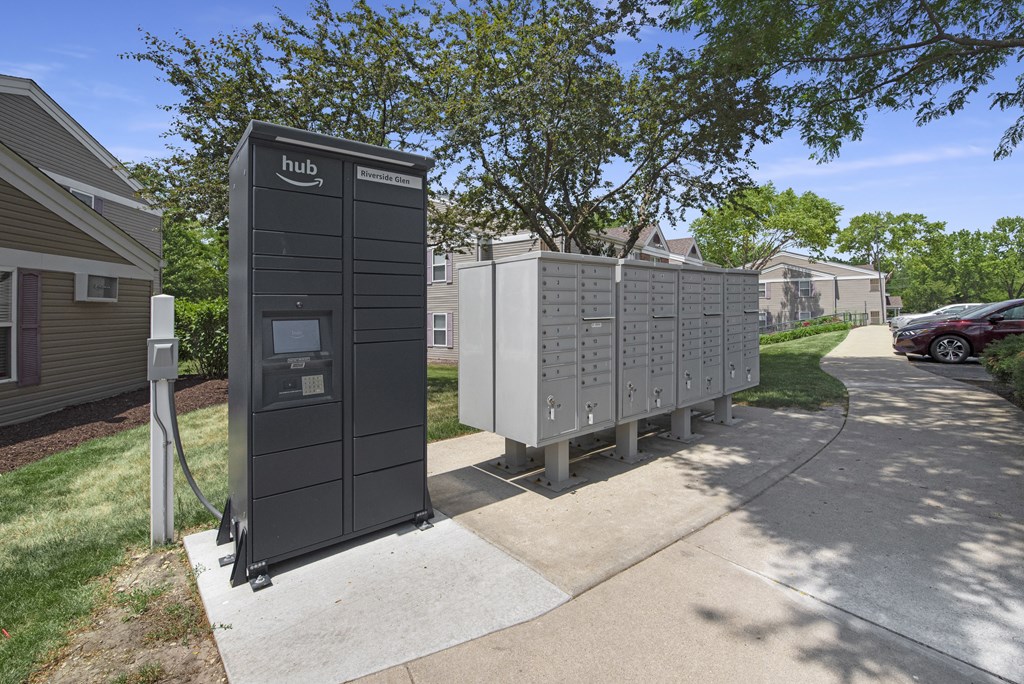 a row of utility boxes sitting on the side of a sidewalk