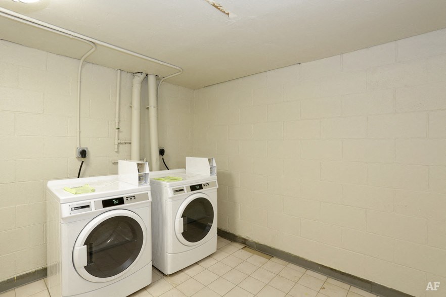 a laundry room with two washing machines in it