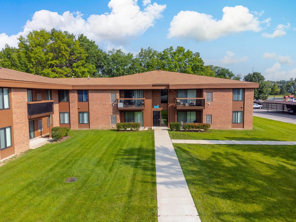 Beautifully landscaped Building Exterior at Westwood Village Apartments in Westland, MI