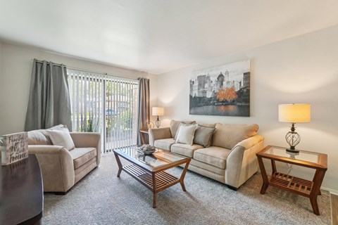 Bright and airy living room with natural light at Eastwood Village Apartments in Clinton Township, MI