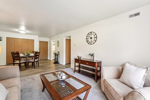 Bright and airy living room with natural light at Eastwood Village Apartments in Clinton Township, MI