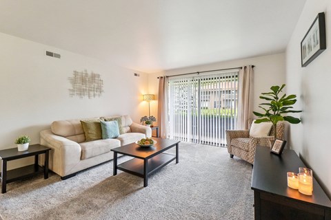 Bright and airy living room with natural light at Eastwood Village Apartments in Clinton Township, MI